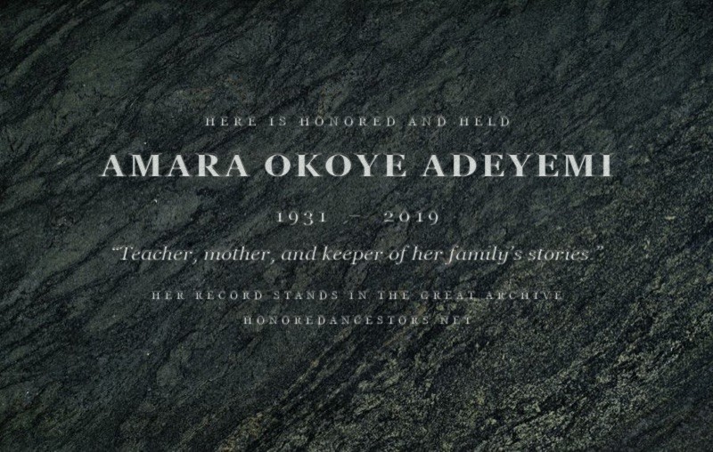 A rendered specimen of the Stone Tablet — Amara Okoye Adeyemi’s name, dates, passage, and key cut into dark granite; every tablet is cut anew
